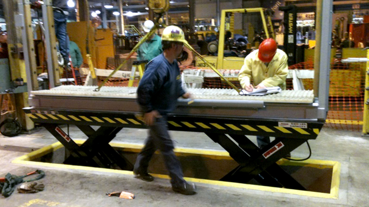 Scissor lift tables in warehouse environments