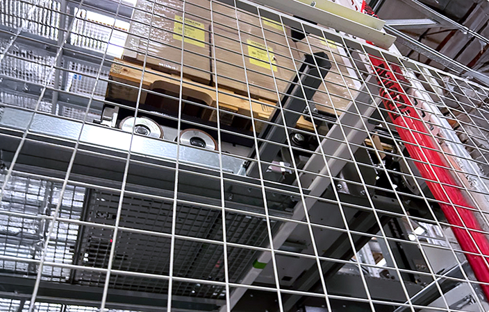 Warehouse ASRS integration with a custom Autoquip lift system